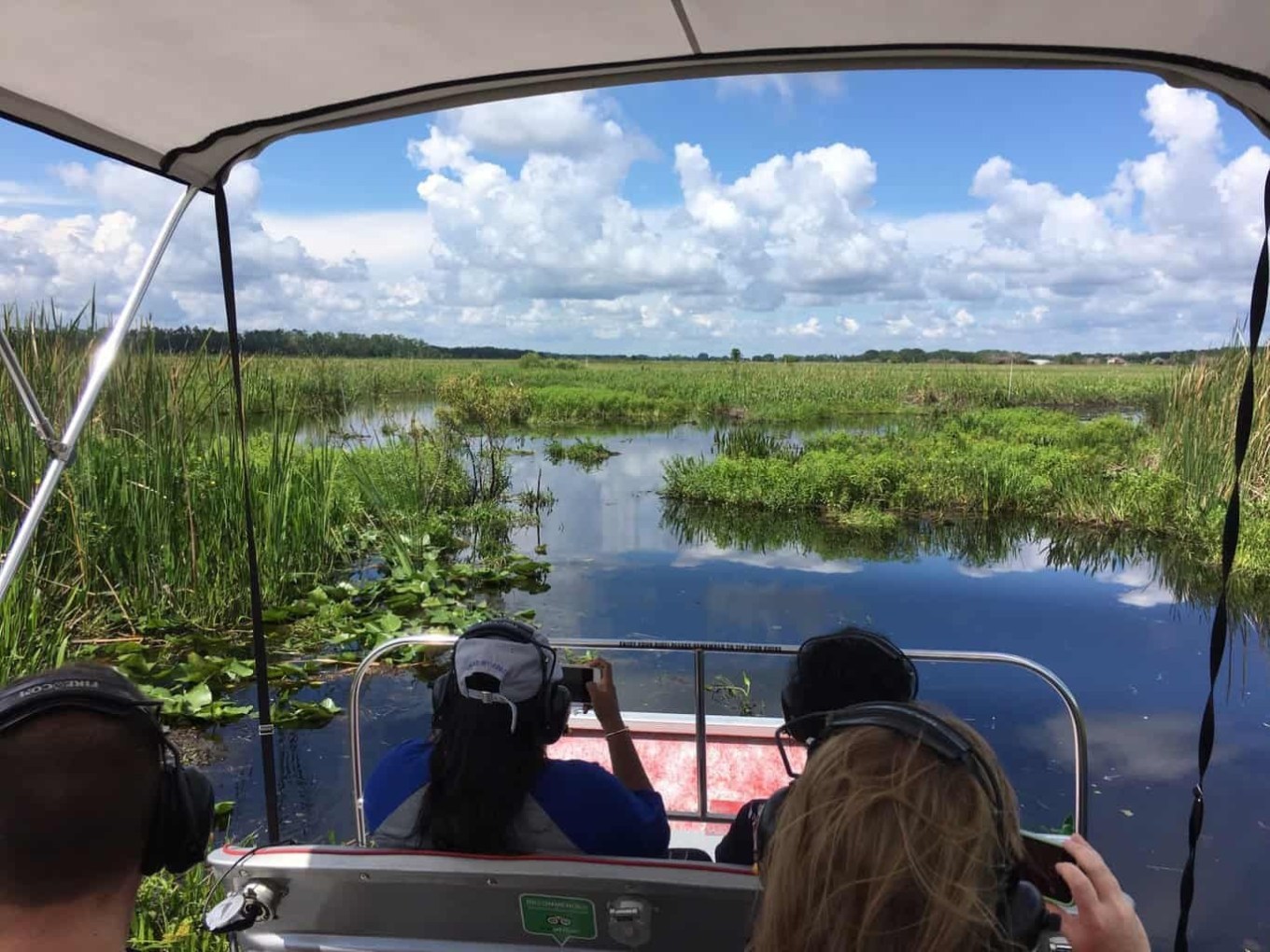 1 Hour Airboat Tour • Private Tour Image 1 a group of people in a boat on a body of water
